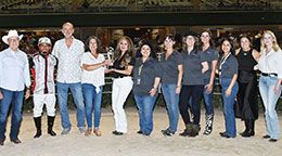 The winning connections of Cowgurl Up accept the Miss Retama Stakes trophy on Friday at Retama Park.