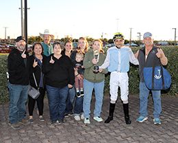 The winning connections of Rock Ya Later accept the Sandia Stakes trophy at Albuquerque Downs on Saturday.