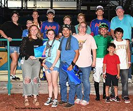 The winning connections of Flying Nova 123 accept the Golden Driller Stakes trophy at Fair Meadows Race Course.