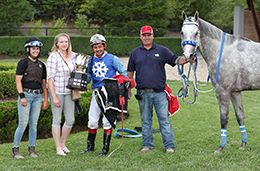 The winning connections of Snow Moose accept the $29,308 Ontario Bred Maturity trophy at Ajax Downs on Wednesday.