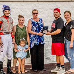 The winning connections of El Turista accept the Esplanade Stakes trophy at Delta Downs on Thursday.