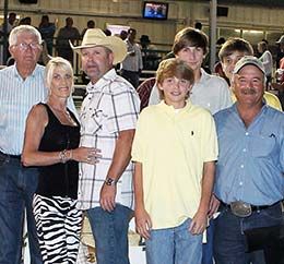 Owners M.C. Morris and Coulon Jumonville, trainer Bobby Martinez in the Vals Fortune winner's circle at Delta Downs.