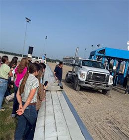 AQHA Youth Experience participants watch as the "Gate Crew" at Delta Downs set the starting gates.