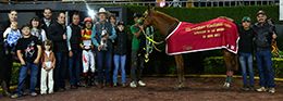 The winning connections of Rey De Manny accept the Garanones Futurity-RG2 trophy at Hipodromo De Las Americas on Sunday.