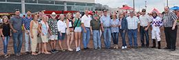 The winning connections of Cr Freighttrain accept the $80,685 Hawkeye Futurity trophy at Prairie Meadows on Saturday.