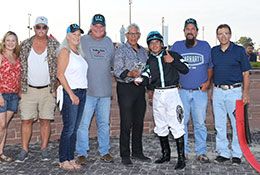 John Hernandez presents the winning connections of American Sparrow the Iowa Stallion Derby stakes trophy.