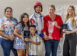 The winning connections of Davsam accept the Firecracker Futurity stakes trophy at Delta Downs Friday night