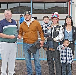The winning owner-trainer Joel Gutierrez and jockey Brian Barraza accept the New Mexico Breeders' Stakes trophy at SunRay Park.