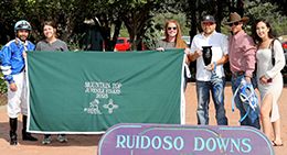 The winning connections of Dyna Mo Chimes accept the Mountain Top NM Bred QH Juvenile trophy on Sunday at Ruidoso Downs.