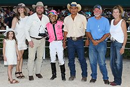 The winning connections of The Grand Legend accept the $44,500 San Marcos Stakes trophy at Retama Park on Saturday.
