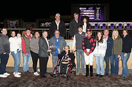 The winning connections of Jjs Sweet And Sassy accept the Minnesota QH Derby stakes trophy on Saturday at Canterbury Park.