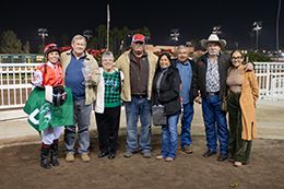 The winning connections of Shaken Goin On accept the Southern California Derby trophy at the Los Alamitos on Sunday.