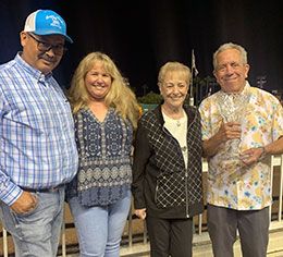 Ed Burgart presents the Los Alamitos Claiming Futurity trophy to Jeryl Hartley, Dana Collum, and Sergio Morfin.