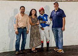 The winning connections of One Fast Cajun accept the $33,000 Virgil Bond Stakes trophy at Delta Downs on Saturday.