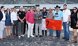 The winning connections of Jessesflyincowgirl accept the Adequan Derby Sam Houston Challenge trophy on Saturday.