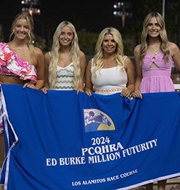 Madison and Bendi Dunn (center) and their guests with the Ed Burke Million blanket.