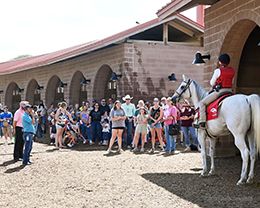 Outrider Cecilia Ramirez provides valuable insights to students and their families through a hands-on introduction to the world of racing at the LOPE Youth Education Event on Saturday afternoon.