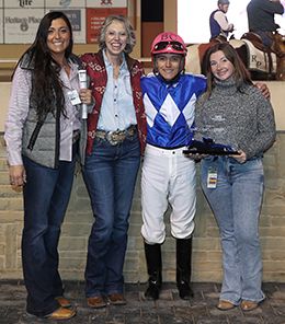 The winning connections of Ima Fancy Eye Opener accept the $75,000 Mighty Deck Three Stakes [RG2] trophy at Remington Park on Sunday.