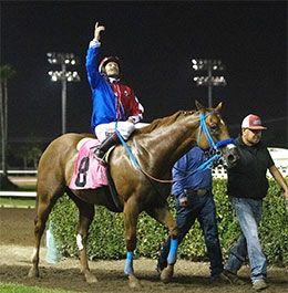 Vessels Maturity winner Empressum and jockey Rodrigo Vallejo enter the Los Alamitos winner's circle.