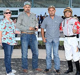 The winning connections of Kas Prietito accept the Willie Hickman Memorial Stakes trophy at Sam Houston Race Park.