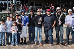 The winning connections of Rollin Candy Dynasty accept the Grade 3 $100,000 Lovington Stakes trophy at Zia Park on Sunday.