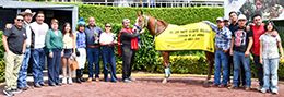 The winning connections of The Singaporean accept the AQHA Hipodromo de las Americas Championship Challenge trophy at Sunday.