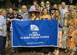 The family of Ed Burke presents the Ed Burke Million Futurity stakes trophy to the winning connections of Jess Im Worth It.