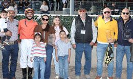 The winning connections of Vegas Trick accept the Hobbs America Derby Invitational Stakes trophy at Zia Park on Sunday.