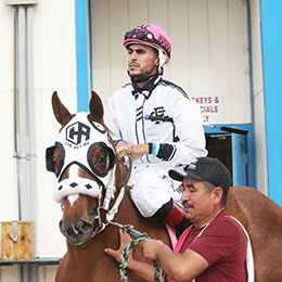 S Super King and jockey Omar Iturralde prior to winning the $216,116 New Mexico Breeders' Futurity stakes trophy on Saturday at SunRay Park.