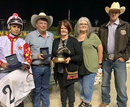 Winning owner Kaye Russell, trainer Monty Arrossa, and jockey Armanda Cervantes are joined in the John Deere California Juvenile Challenge winners circle Saturday night.