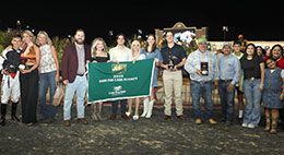 The winning connections of Ivory Macho Man accept the Dash For Cash Futurity stakes trophy at Lone Star Park Saturday night.