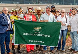 The winning connections of San Lorenzo Firulais accept the LQHBA Sale Futurity stakes trophy at Fair Grounds Race Course.
