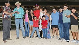 The winning connections of Sonny Surfer accept the San Marcos Stakes trophy at Retama Park on Saturday.