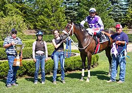 The winning connections of Cindy Loo Who accept the $38,023 (US) Princess Derby trophy at Ajax Downs on Wednesday.