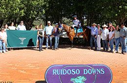 The winning connections of Holy Pete accept the Ruidoso Quarter Horse Invitational stakes trophy at Ruidoso Downs Racetrack & Casino.