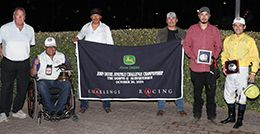 The winning connections of Arbitro accept the $144,100 John Deere Juvenile Challenge [G2] trophy at The Downs At Albuquerque on Saturday.