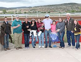 The winning connections of Lil Pollys Train accept the 307HR Wyoming Bred QH Futurity trophy at Wyoming Downs on Saturday.