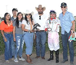 The winning connections of Karmalites accept the John Deere Ruidoso Juvenile Challenge stakes trophy at The Downs at Albuquerque.