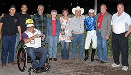 The winning connections of Aj Run For Cash accept the $40,000 Casino at the Downs Quarter Horse Stakes trophy at The Downs At Albuquerque on Saturday.
