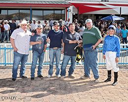The winning connections of Naughty Politics accept the $75,000 La Plata Stakes at SunRay Park on Sunday.