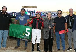 The winning connections of Ap Political Patriot accept the Sterlie Bertram Memorial Stakes trophy at Horseshoe Indianapolis.