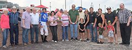 The winning connections of Ct Walking Thru accept the $213,400 Prairie Meadows Gold Futurity trophy at Prairie Meadows on Saturday.