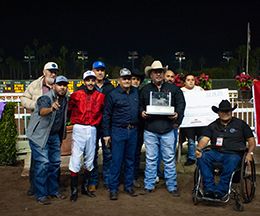 The winning connections of Toby Sis accept the $1.9 Million Los Alamitos $2 Million Futurity-G1 trophy Sunday.