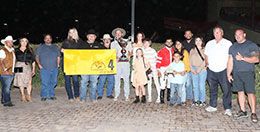 The winning connections of Out Of The Way accept the Downs at Albuquerque Fall QH Championship Stakes trophy on Saturday.