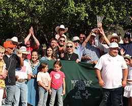 The winning connections of Luxurie accept the Mountain Top New Mexico Bred QH Futurity stakes trophy at Ruidoso Downs Sunday.