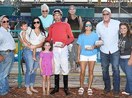 The winning connections of Set On Cruise accept the Speedhorse Paint & Appaloosa Juvenile Stakes trophy at Fair Meadows Saturday.