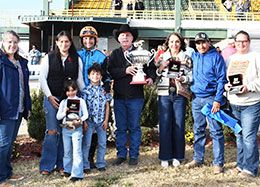 The winning connections of Flying Nova 123 accept the OQHRA Mystery Derby stakes trophy.