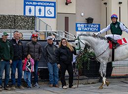 The winning connections of Flight Club in the Century Downs winner's circle on Saturday.
