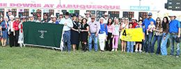 The winning connections of Especially Goodcandy gather in The Downs at Albuquerque infield to accept the All American Oaks stakes trophy on Monday.