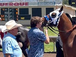 Zach and John Stinebaugh pick up Envestor following his August 4 All American Futurity trial win.